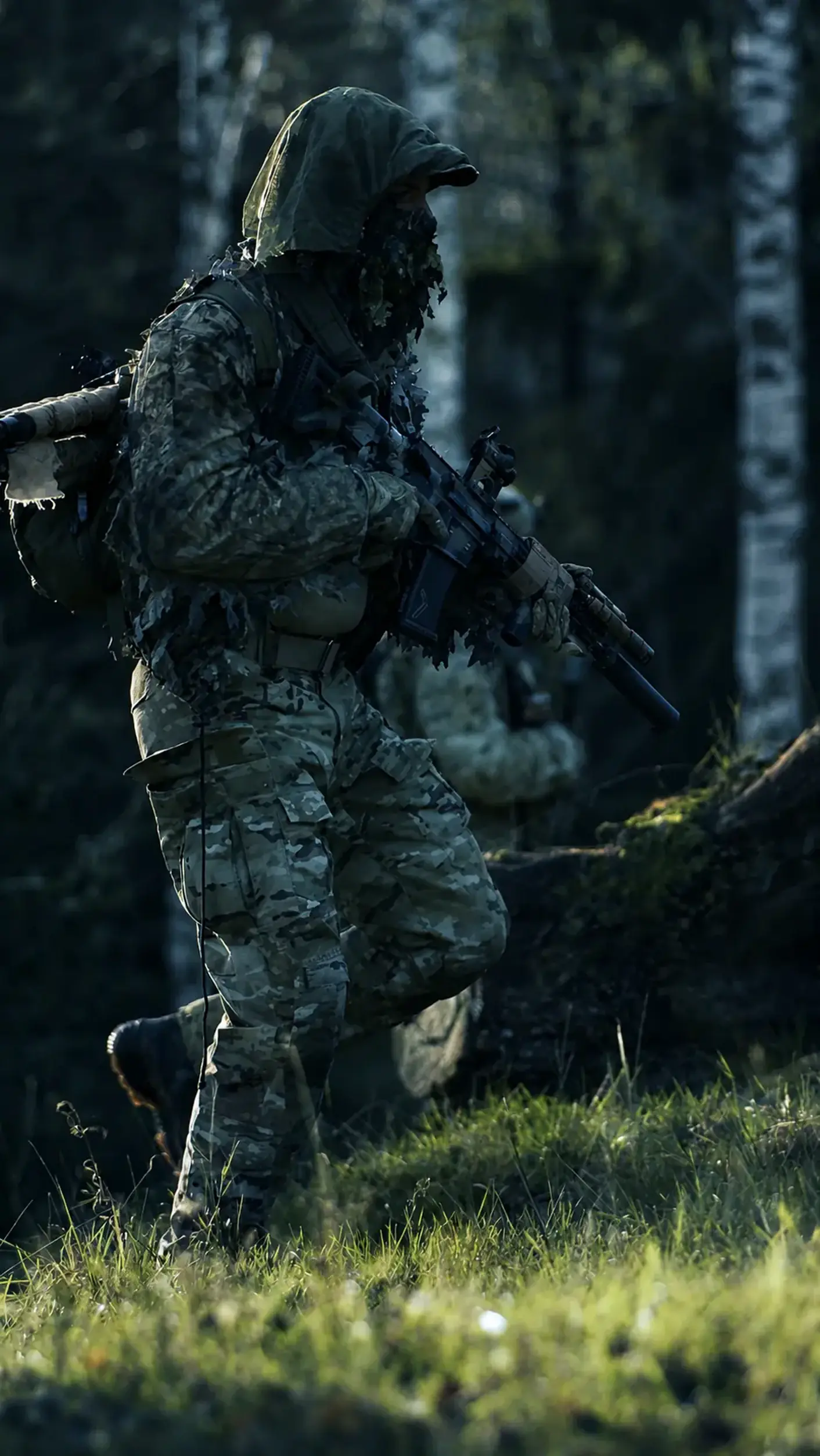 Tactical operator moving through woodland in a cinematic visual