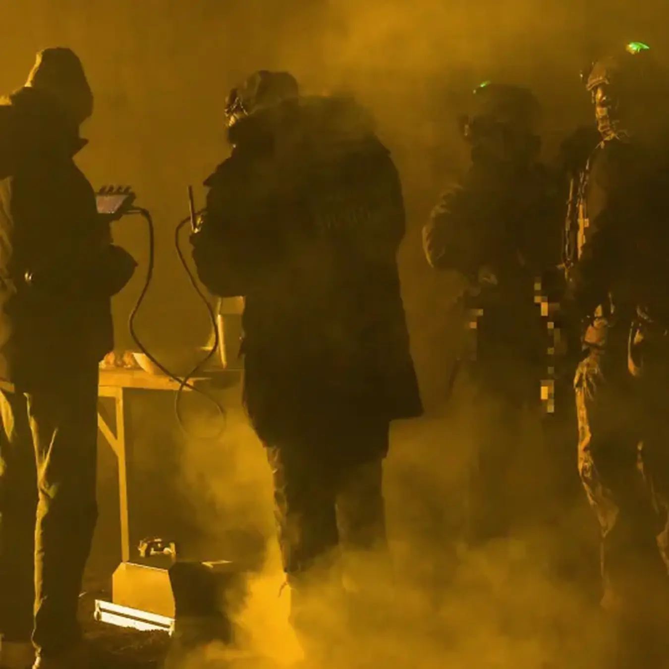 TacCine crew preparing a tactical night scene in haze